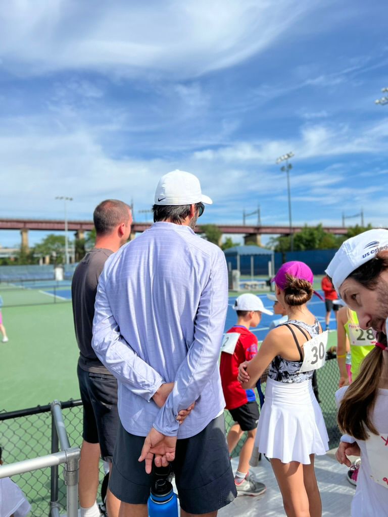 Junior players training on court