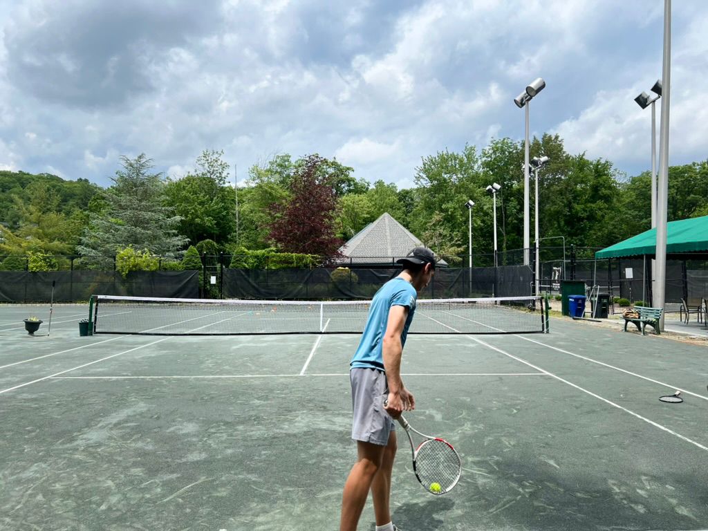 Junior players training on court