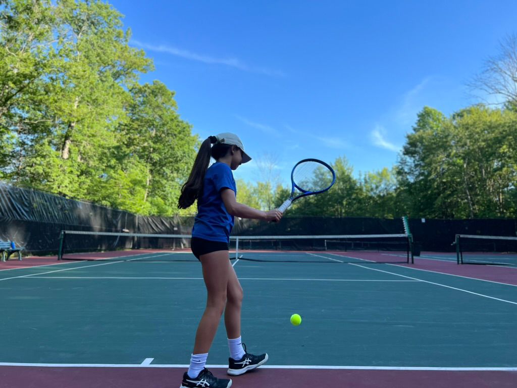 Junior players training on court