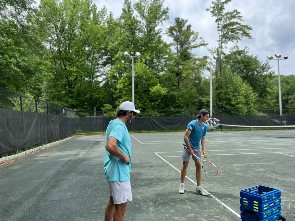 Junior players training on court
